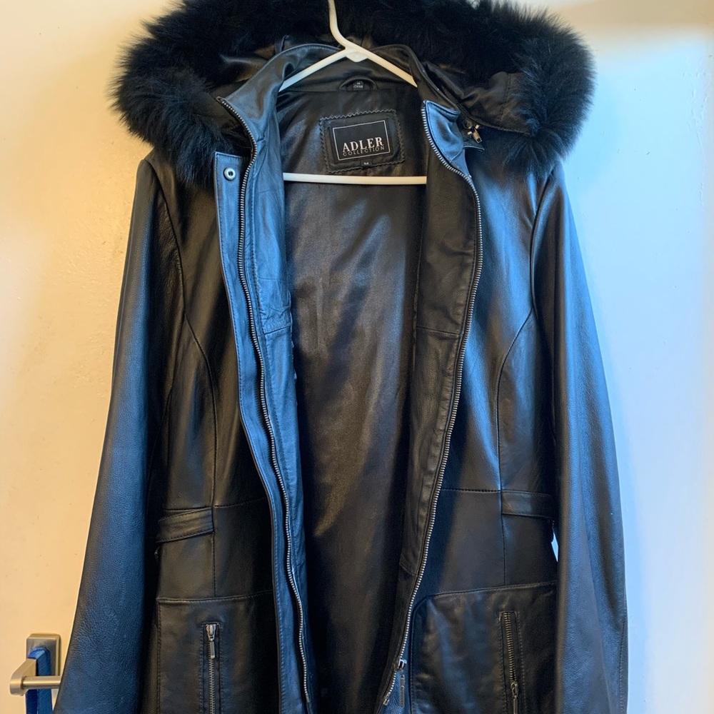 Leather jacket with hood and trim fur